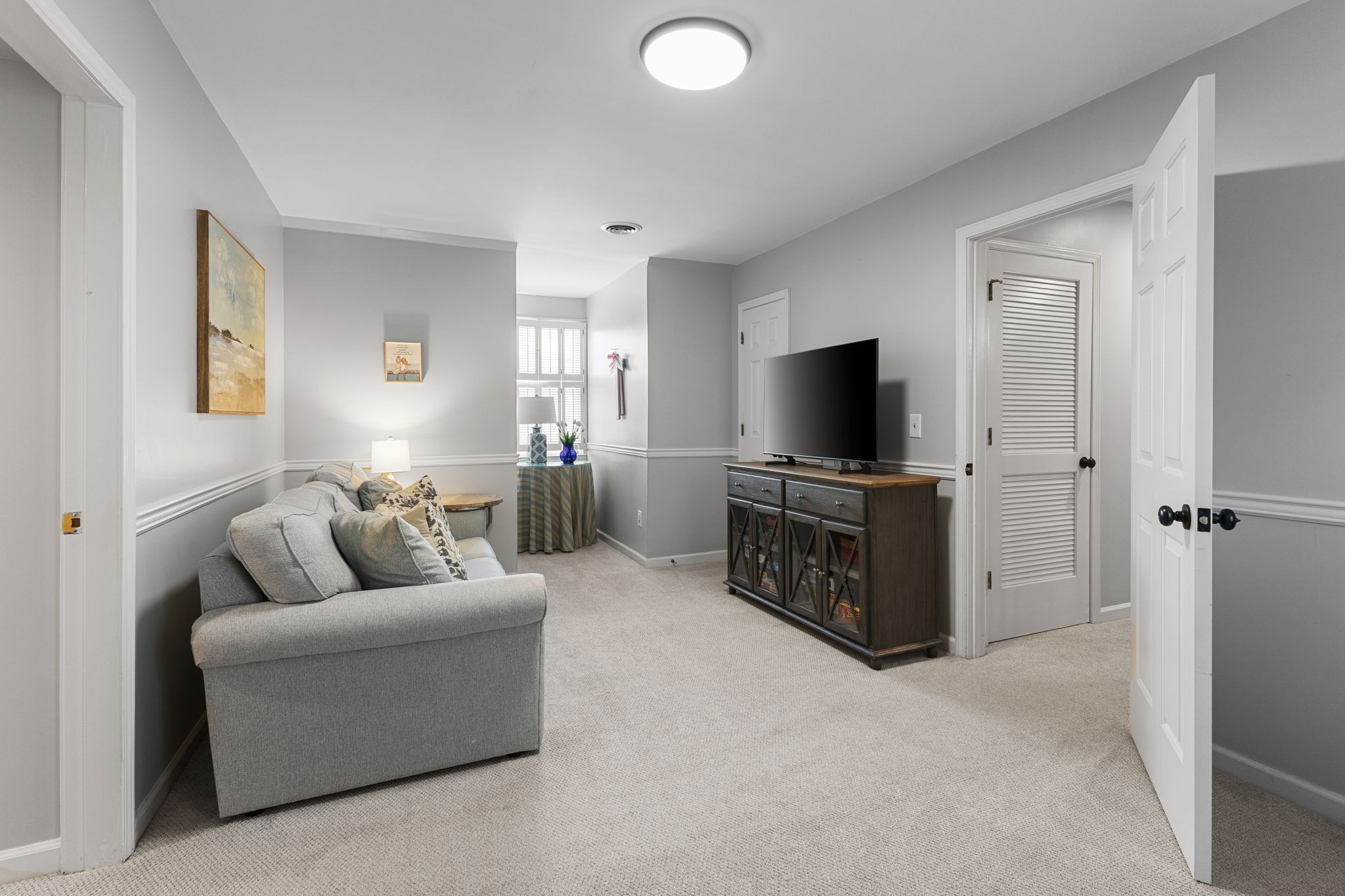 1517 Pinkerton Road Brentwood, TN 37027 - Photo 33 of 49 a living room with furniture and a flat screen tv