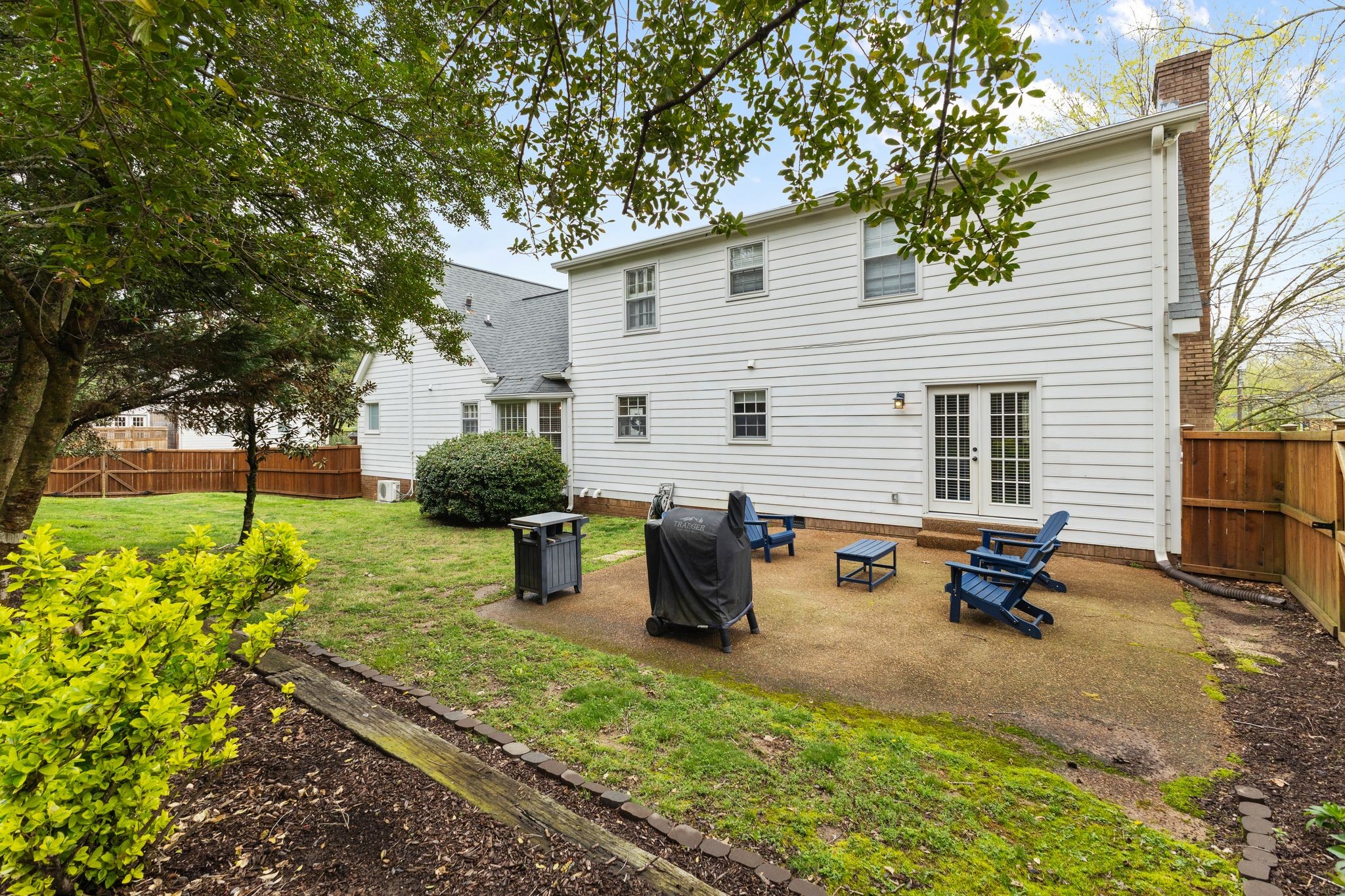 1517 Pinkerton Road Brentwood, TN 37027 - Photo 39 of 49 a backyard of a house with table and chairs