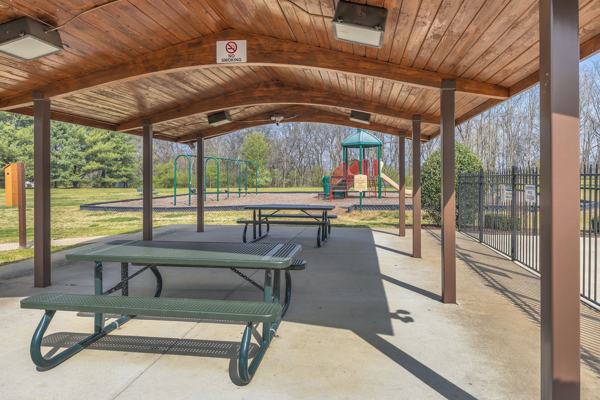 1517 Pinkerton Road Brentwood, TN 37027 - Photo 46 of 49 a view of a swimming pool with a table and chairs in front of it