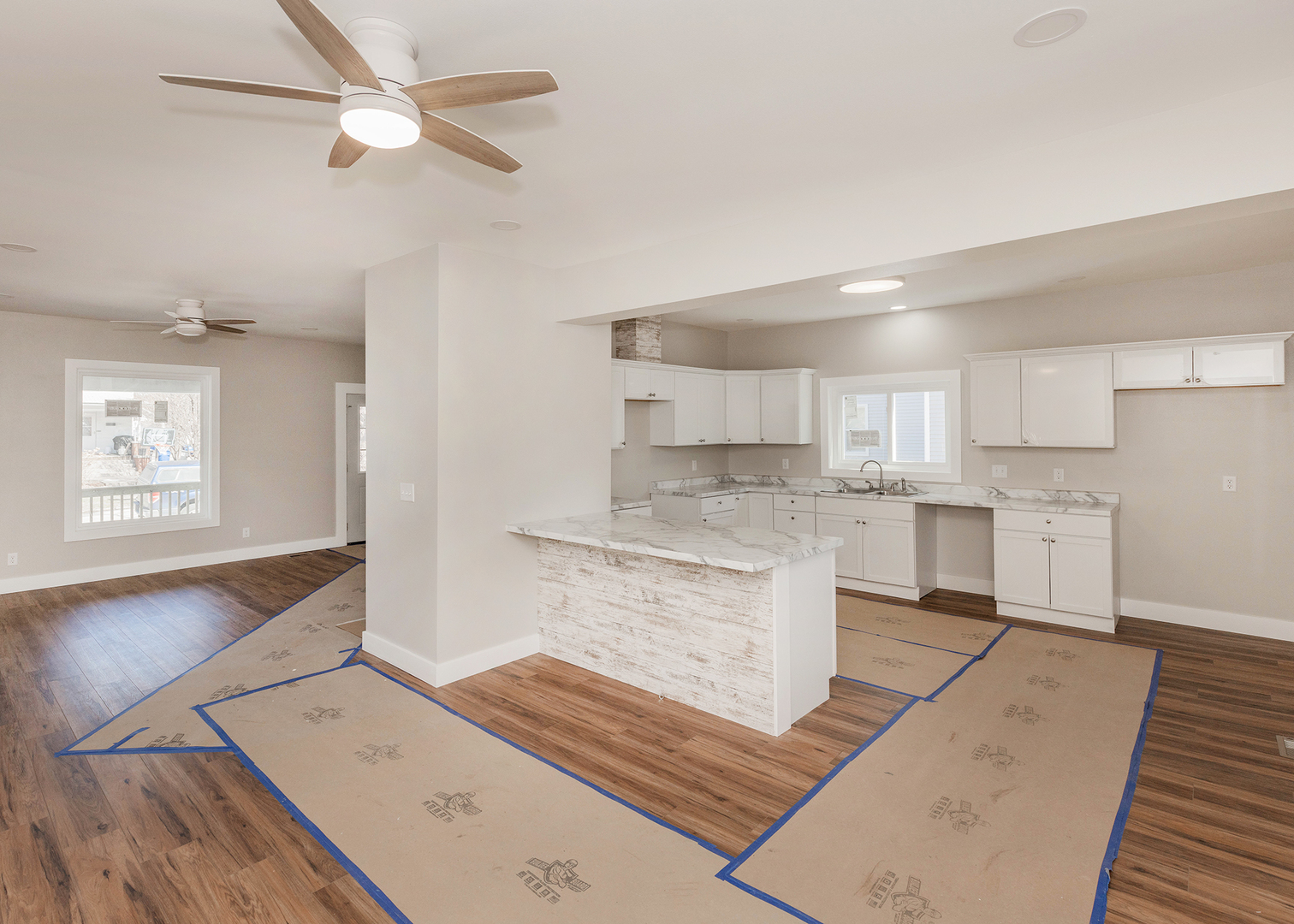 1212 14th Avenue Moline, IL 61265 - Photo 14 of 32 a large kitchen with cabinets wooden floor and stainless steel appliances