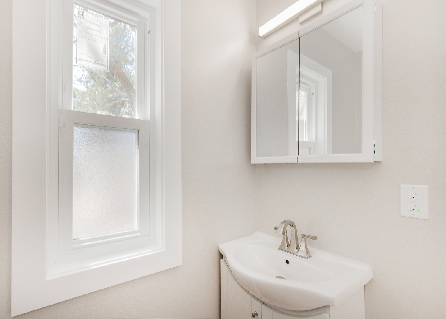 1212 14th Avenue Moline, IL 61265 - Photo 15 of 32 a bathroom with a sink and a window