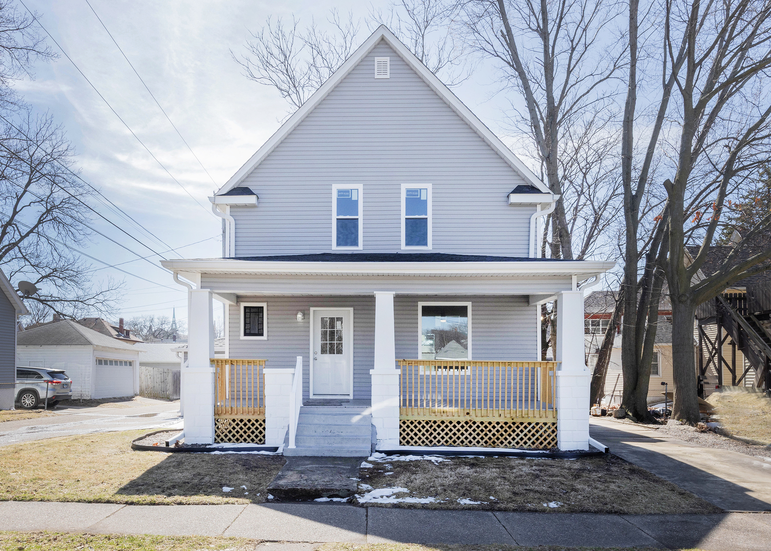 1212 14th Avenue Moline, IL 61265 - Photo 2 of 32 a front view of a house with a yard