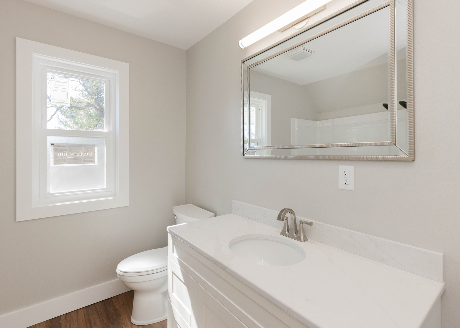 1212 14th Avenue Moline, IL 61265 - Photo 23 of 32 a white toilet sitting next to a bathroom sink