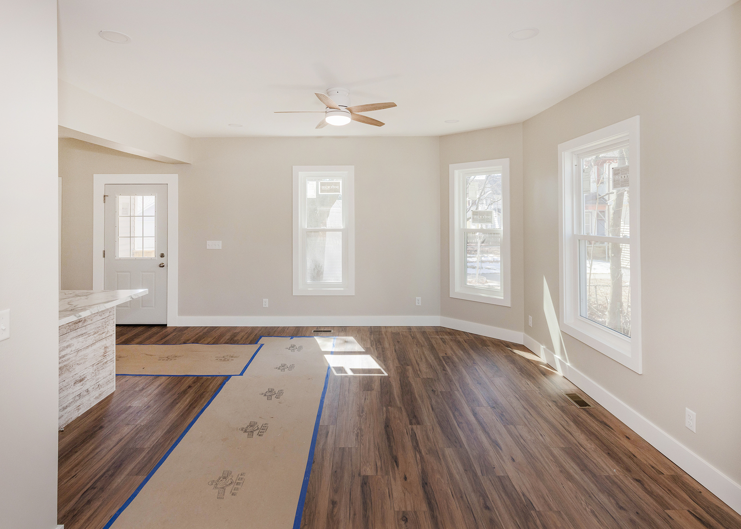 1212 14th Avenue Moline, IL 61265 - Photo 6 of 32 an empty room with wooden floor and windows