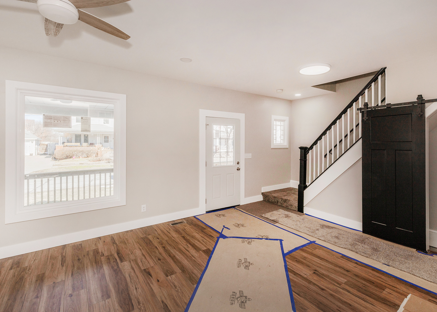 1212 14th Avenue Moline, IL 61265 - Photo 9 of 32 a view of empty room with wooden floor and fan