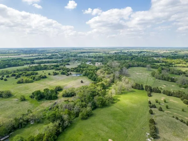 a view of a lake with green space
