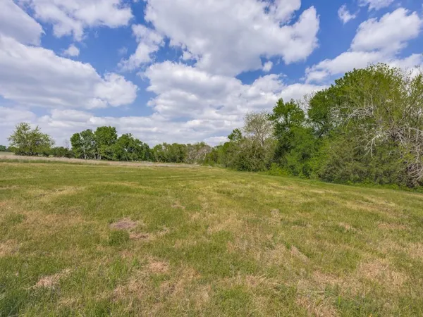 a view of a lake with a big yard