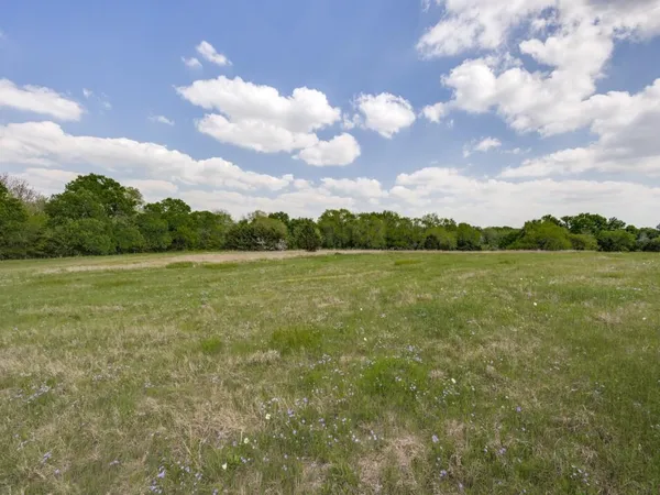 a view of a lake with a big yard