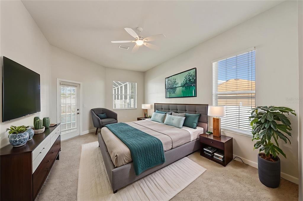 4925 Brightstone Place Spring Hill, FL 34609 - Photo 15 of 40 a bedroom with a bed and a flat screen tv