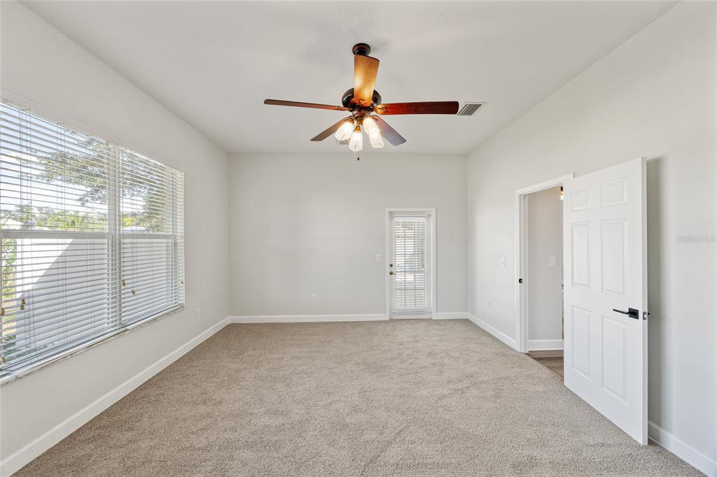 4925 Brightstone Place Spring Hill, FL 34609 - Photo 21 of 40 wooden floor in an empty room with a window