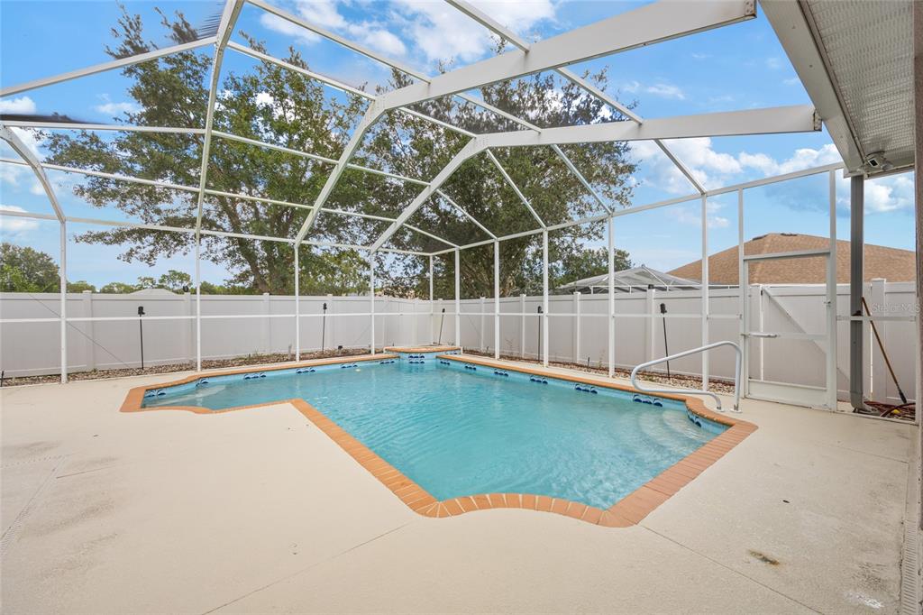 4925 Brightstone Place Spring Hill, FL 34609 - Photo 33 of 40 a view of a backyard