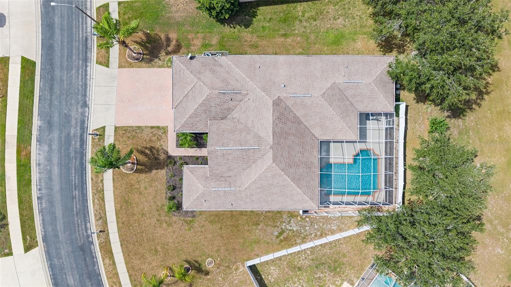 4925 Brightstone Place Spring Hill, FL 34609 - Photo 35 of 40 aerial view of a house with a swimming pool