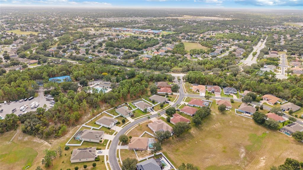 4925 Brightstone Place Spring Hill, FL 34609 - Photo 38 of 40 an aerial view of a city with lots of residential buildings