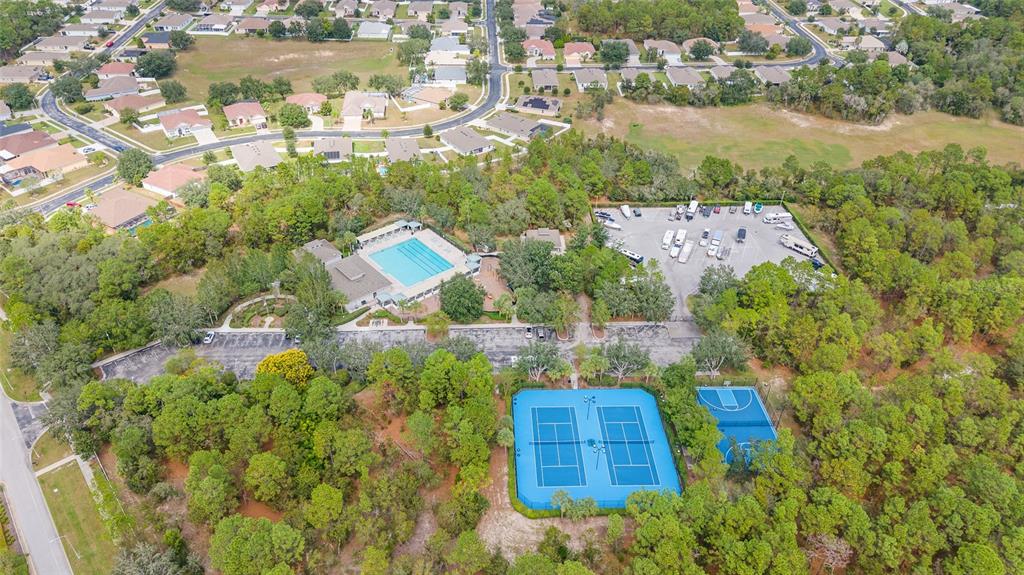 4925 Brightstone Place Spring Hill, FL 34609 - Photo 39 of 40 a aerial view of a house with a yard and lake view