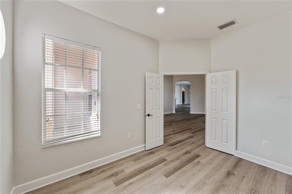 4925 Brightstone Place Spring Hill, FL 34609 - Photo 7 of 40 a view of a room with wooden floor and window