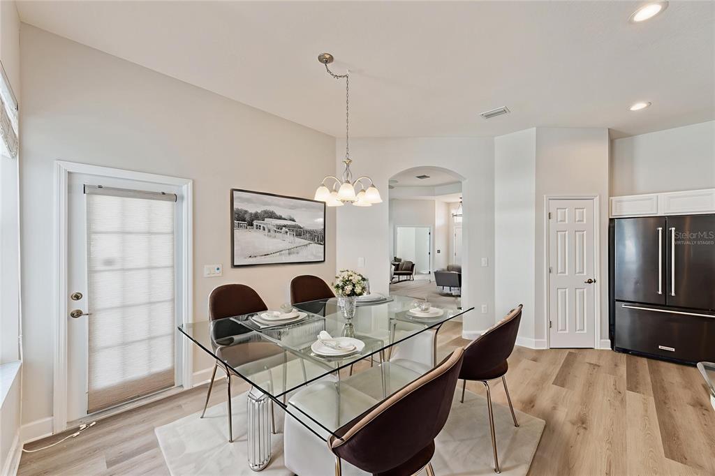 4925 Brightstone Place Spring Hill, FL 34609 - Photo 9 of 40 a view of a dining room with furniture