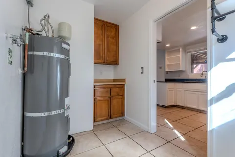 a kitchen with a refrigerator and a sink