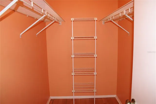 a bathroom with a walk in closet