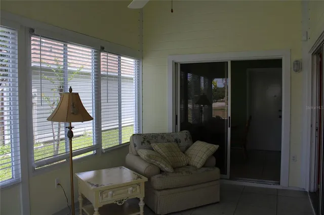 a living room with furniture and a window