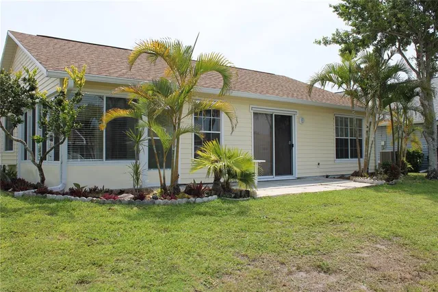 a front view of house with yard and outdoor seating