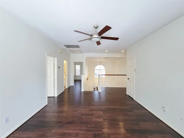 a view of a hallway with a window