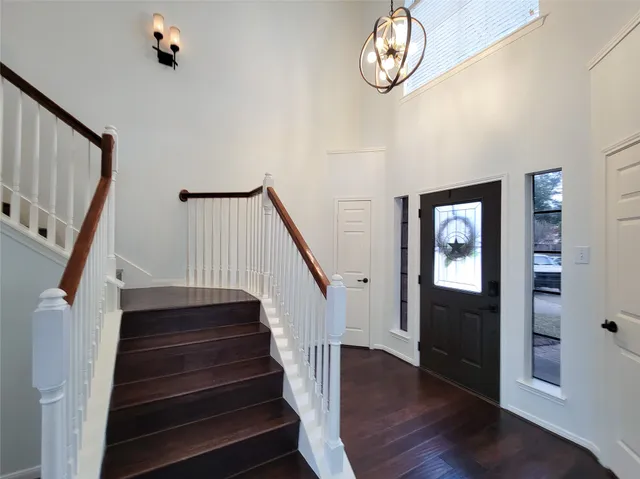 a view of entryway with wooden floor