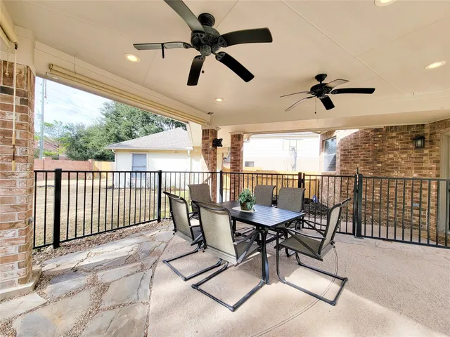 a view of a patio with a backyard