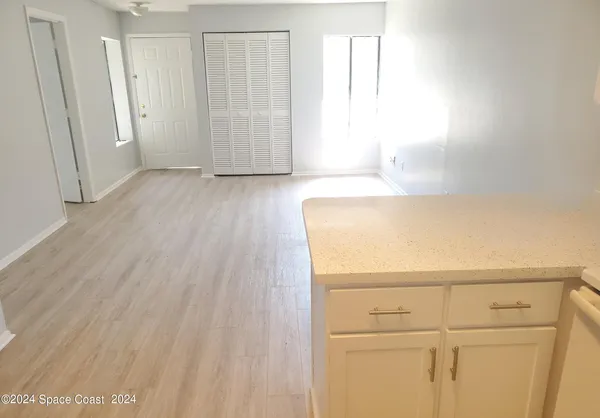 a view of storage and utility room with closet