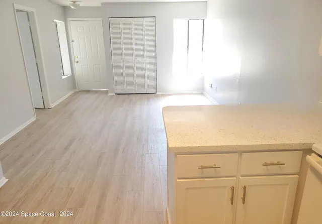a view of storage and utility room with closet