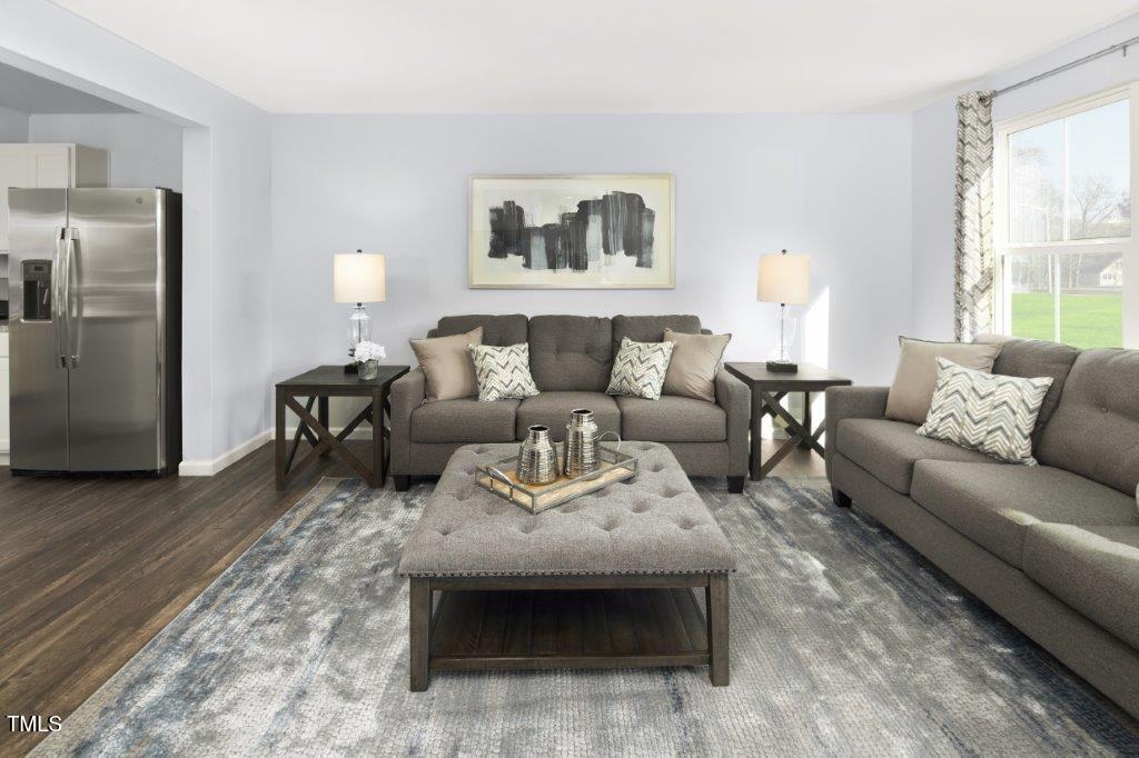 290 Grand Silo Road Raleigh, NC 27603 - Photo 7 of 18 a living room with furniture and a couch