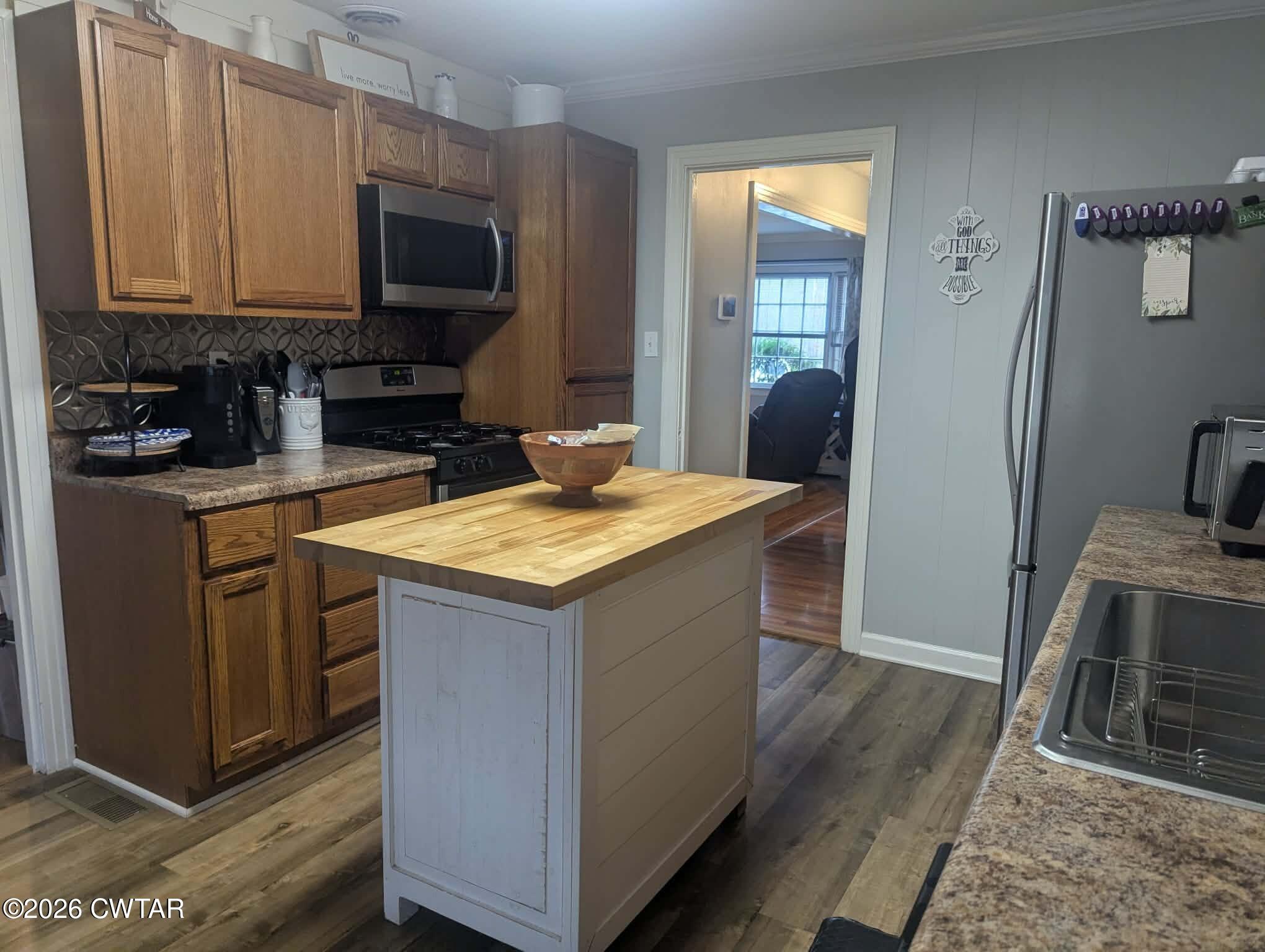 4072 Beech Bluff Road Beech Bluff, TN 38313 - Photo 15 of 51 a kitchen with stainless steel appliances granite countertop a stove a sink and a microwave