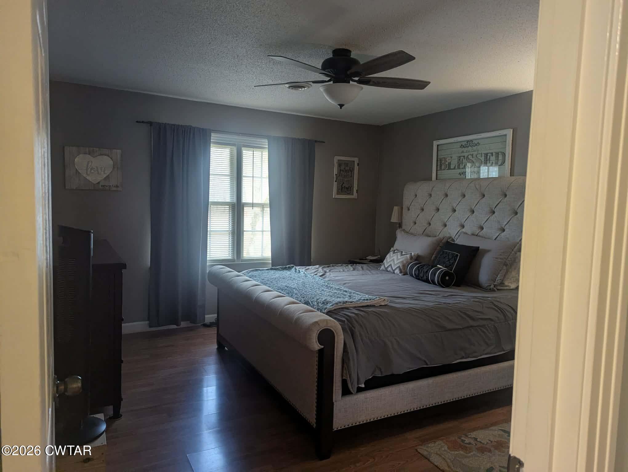 4072 Beech Bluff Road Beech Bluff, TN 38313 - Photo 21 of 51 a bedroom with a bed and a chandelier