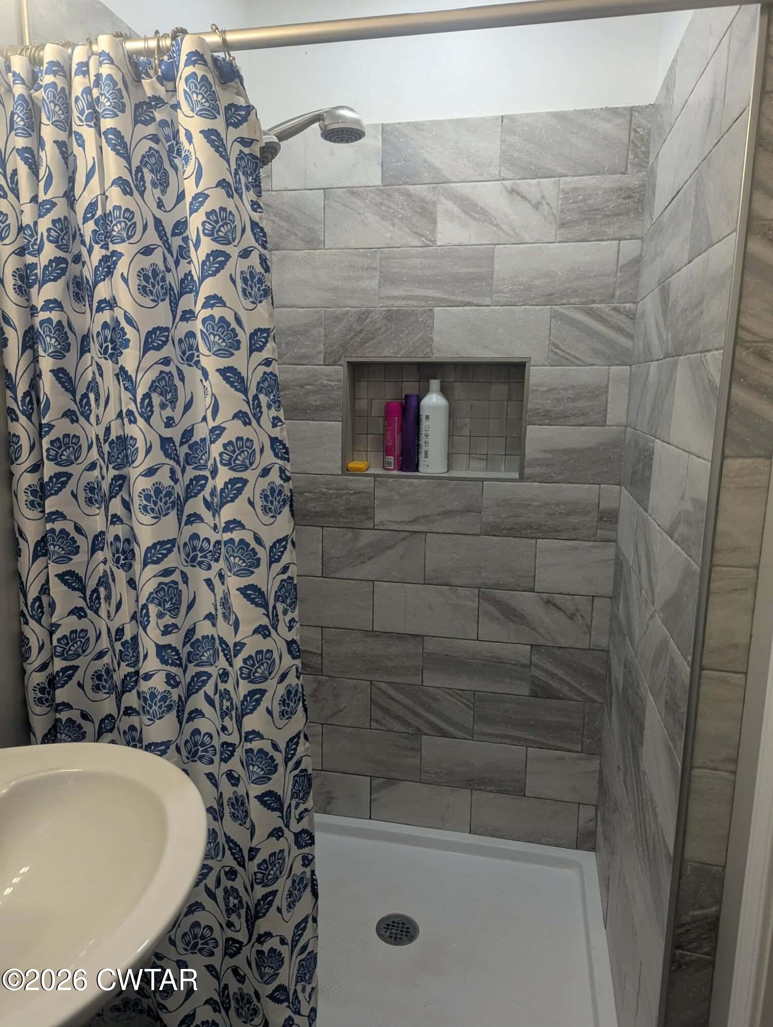 4072 Beech Bluff Road Beech Bluff, TN 38313 - Photo 25 of 51 a bathroom with a bathtub and shower