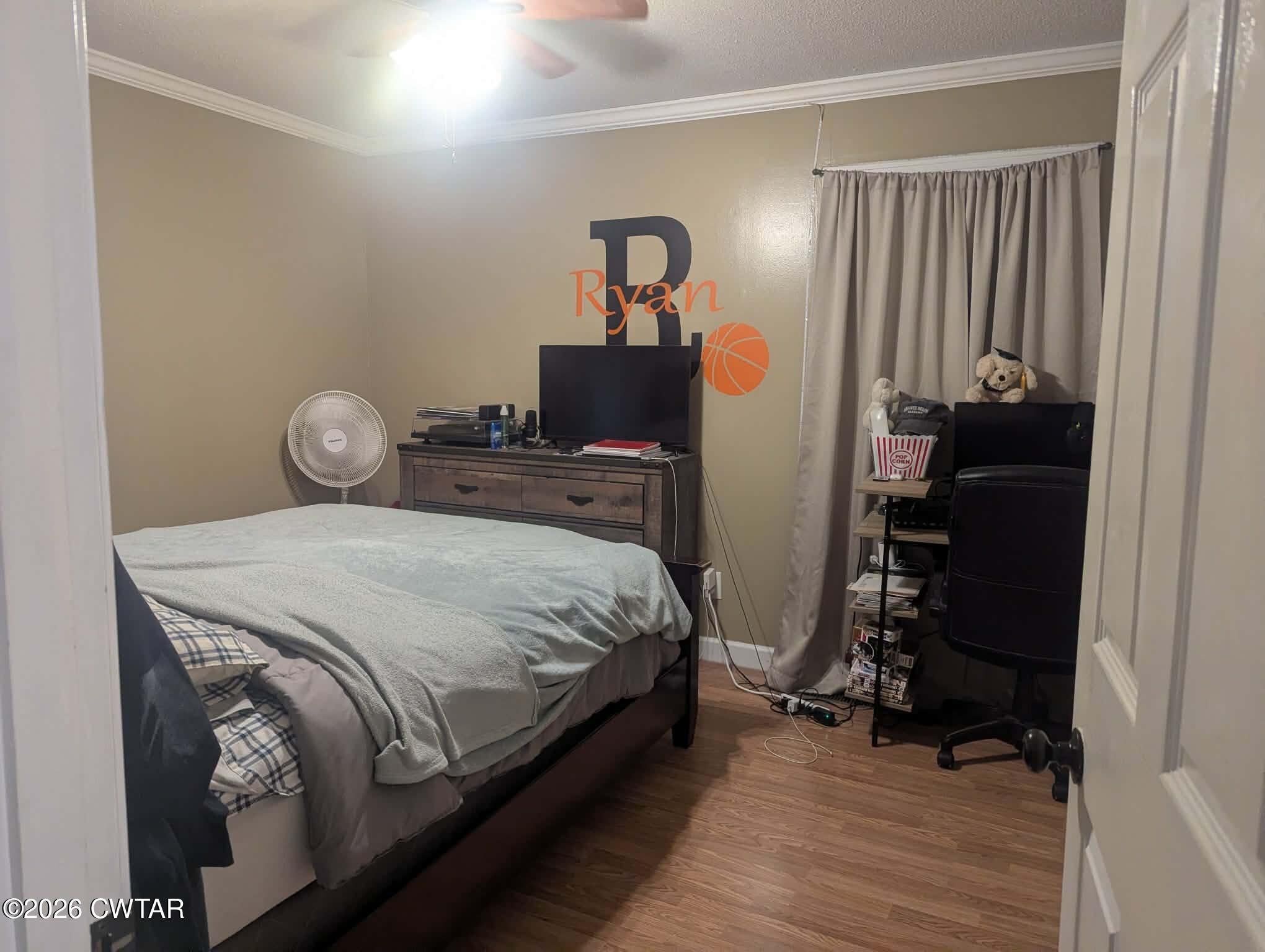 4072 Beech Bluff Road Beech Bluff, TN 38313 - Photo 28 of 51 a bedroom with bed and wooden floor