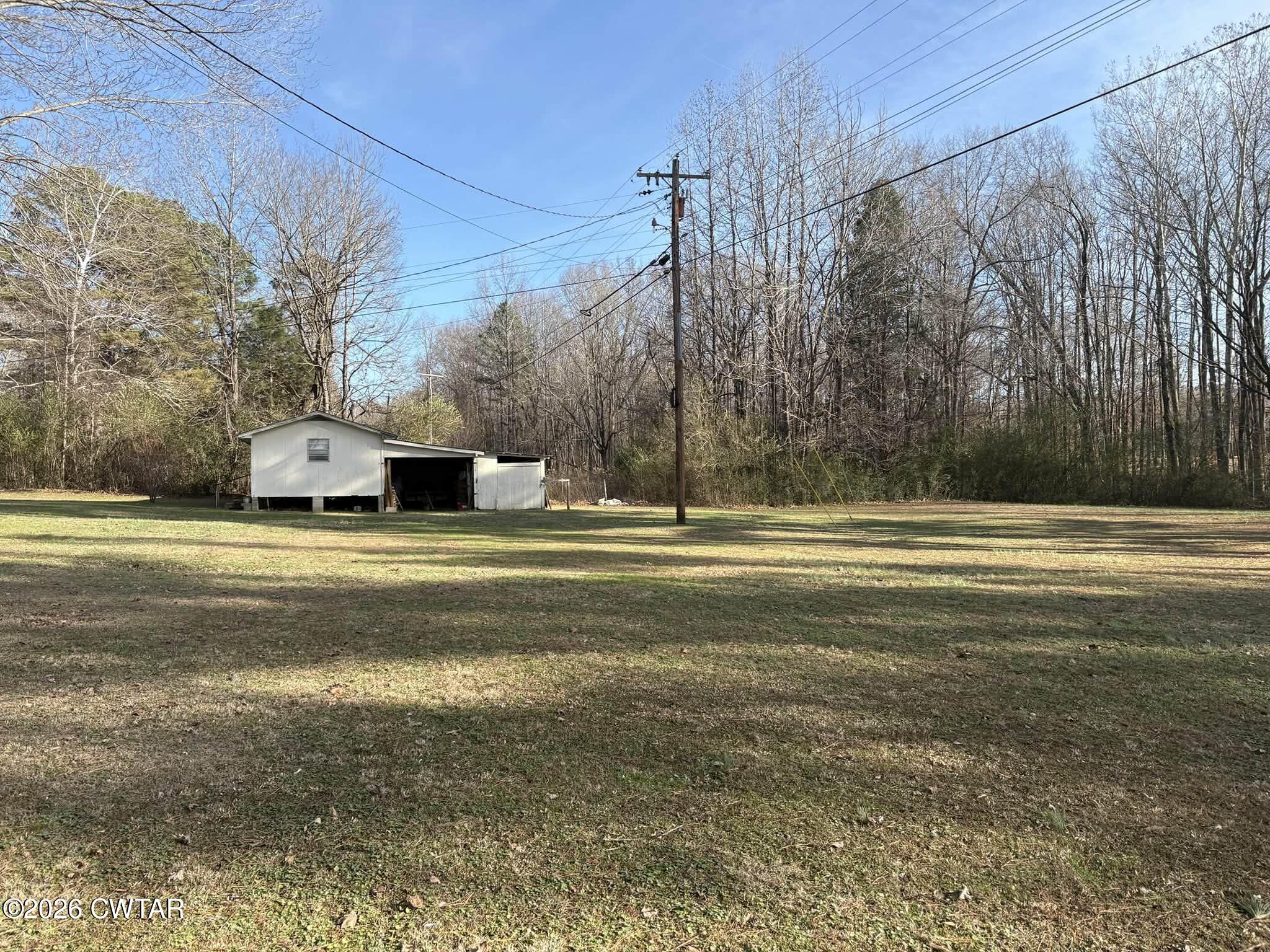 4072 Beech Bluff Road Beech Bluff, TN 38313 - Photo 37 of 51 a view of a house with a yard