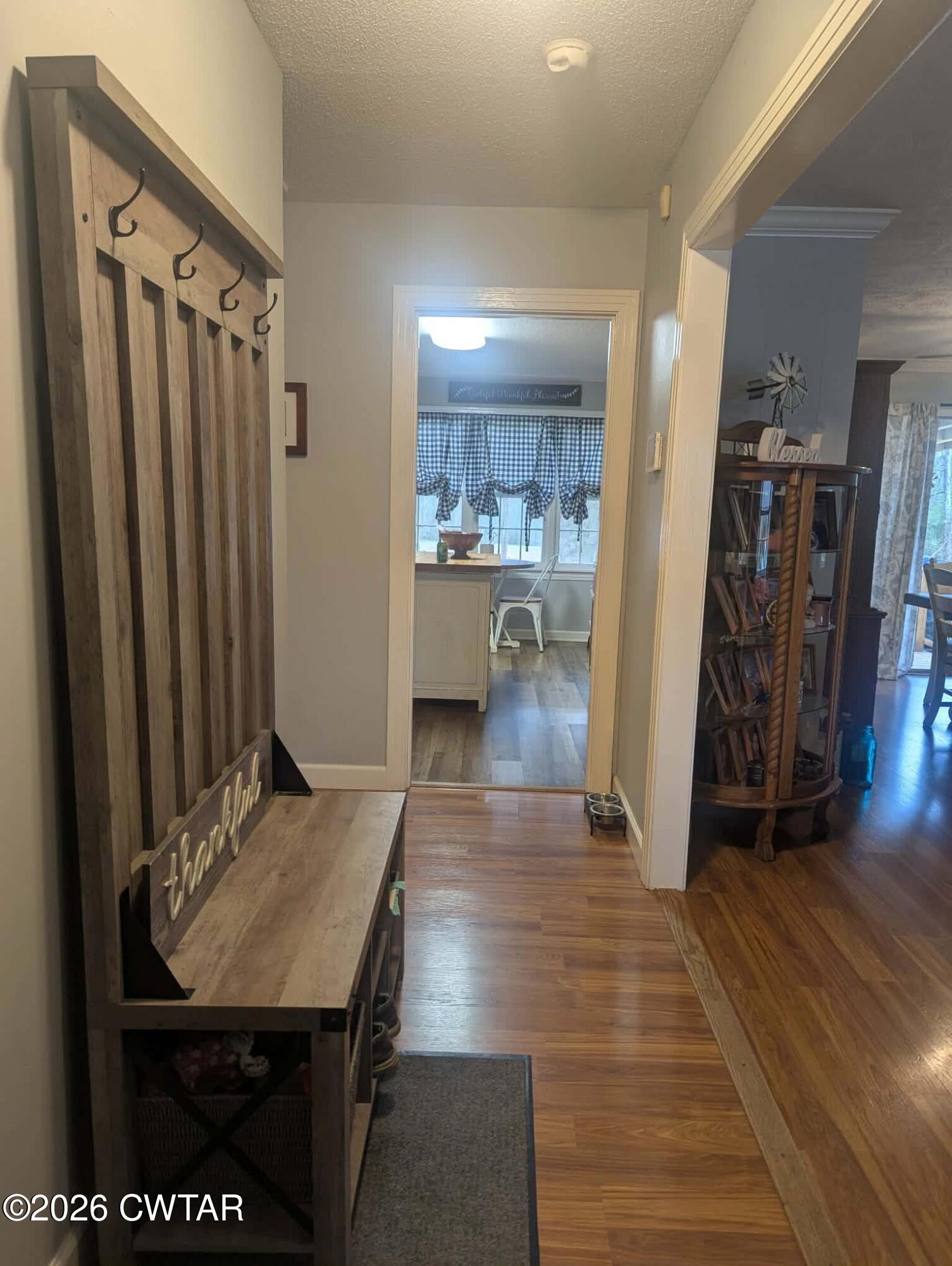 4072 Beech Bluff Road Beech Bluff, TN 38313 - Photo 5 of 51 a view of a hallway with furniture and wooden floor