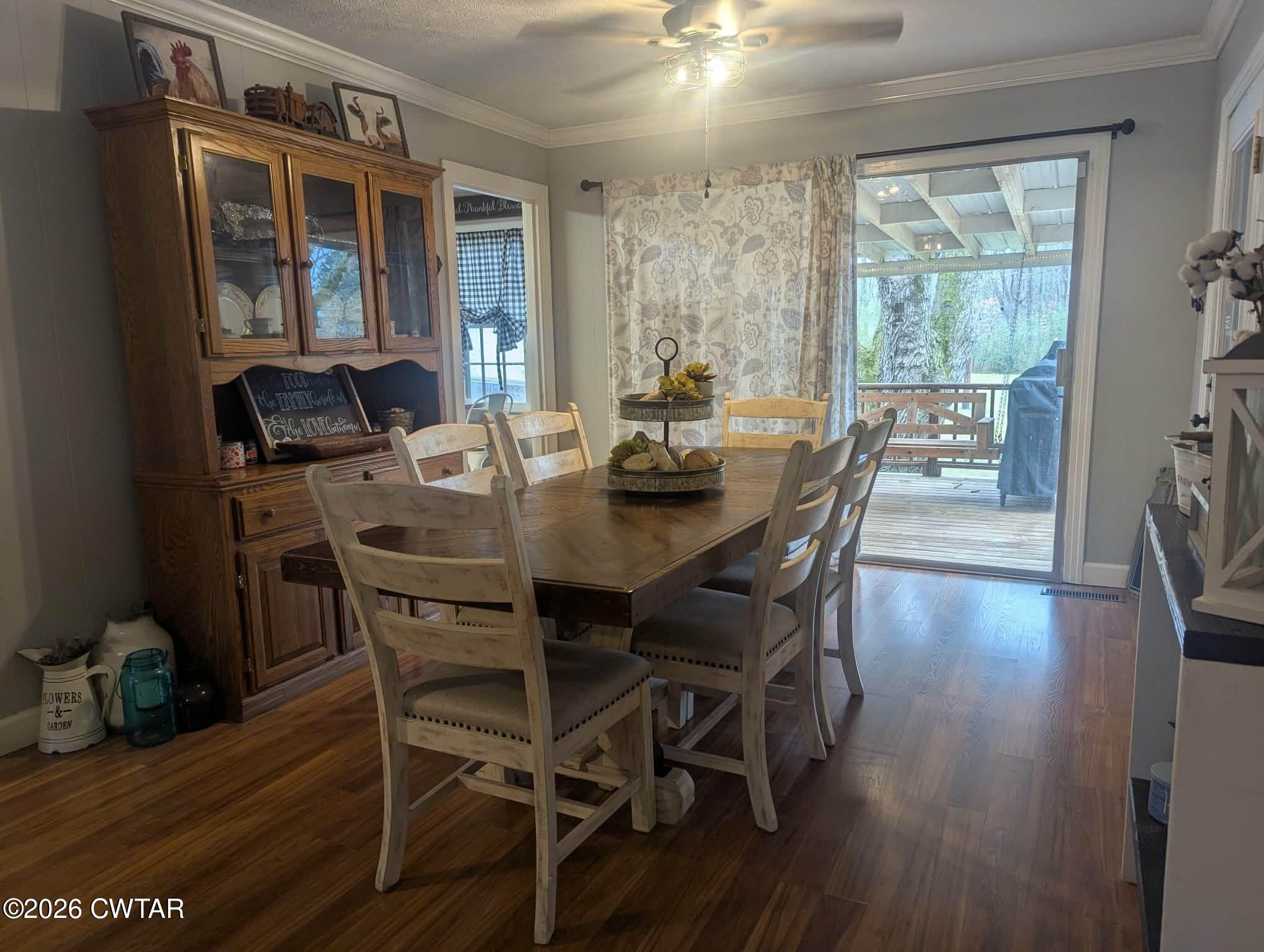 4072 Beech Bluff Road Beech Bluff, TN 38313 - Photo 8 of 51 a view of a dining room with furniture window and wooden floor