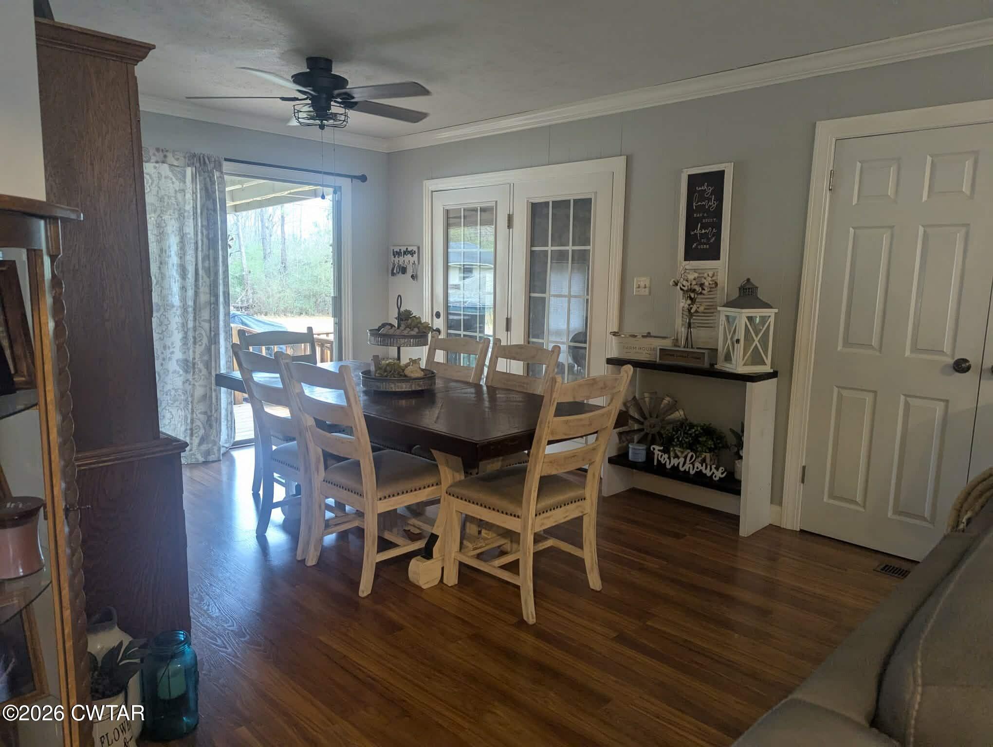 4072 Beech Bluff Road Beech Bluff, TN 38313 - Photo 9 of 51 a dining room with furniture a chandelier and wooden floor
