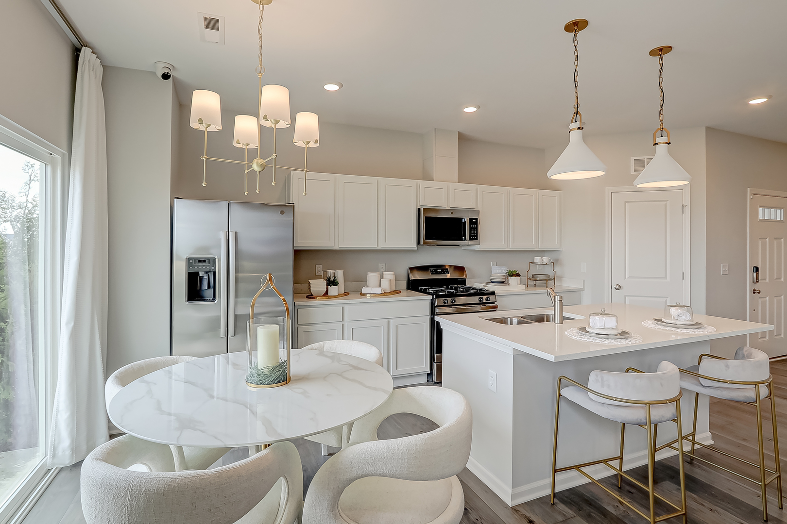 475 Comstock Road South Elgin, IL 60177 - Photo 7 of 31 a kitchen with stainless steel appliances kitchen island granite countertop a sink a microwave a refrigerator and chairs