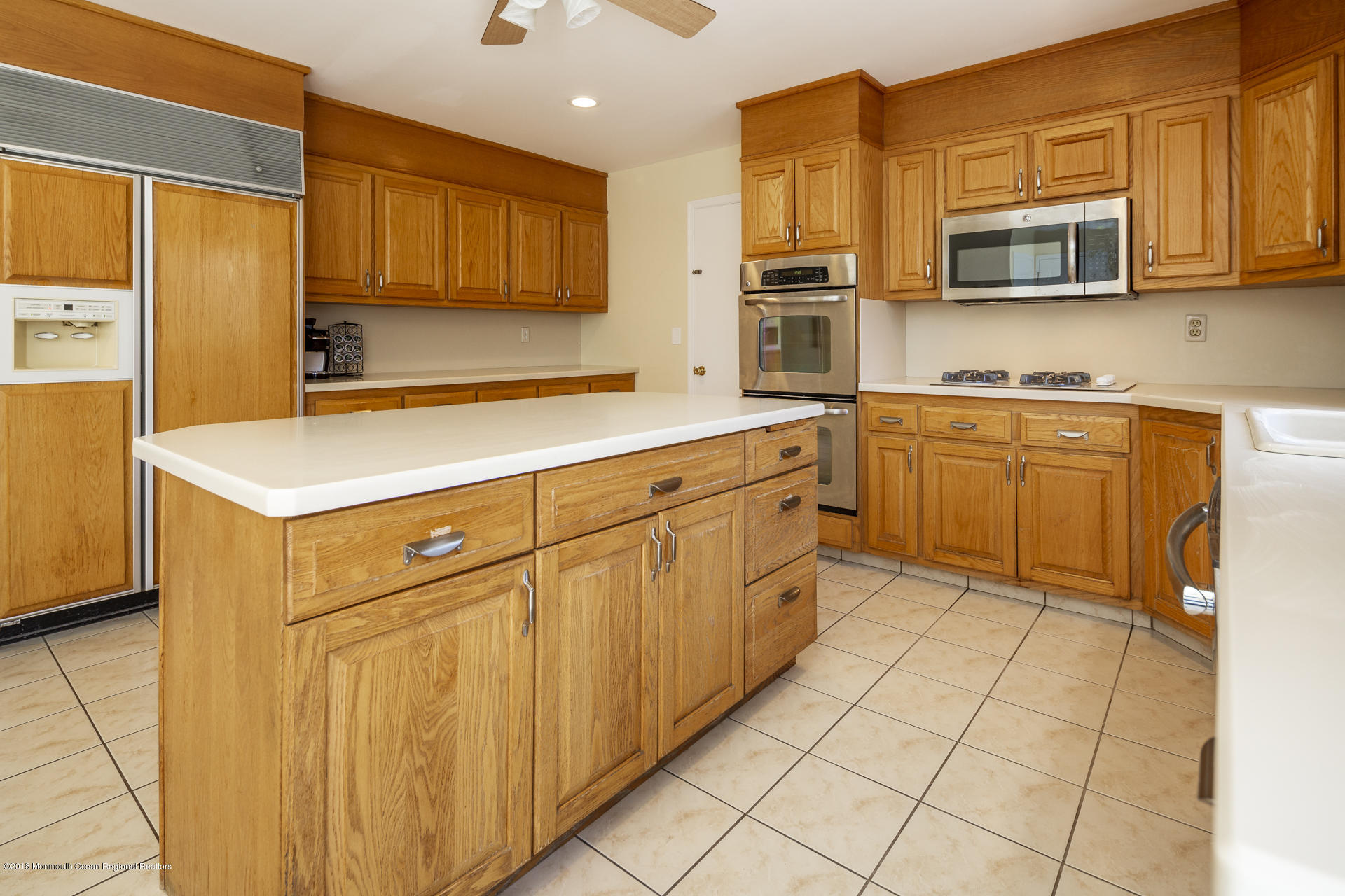 10 Green Hill Road Colts Neck, NJ 07722 - Photo 14 of 33 a kitchen with stainless steel appliances granite countertop a refrigerator and cabinets