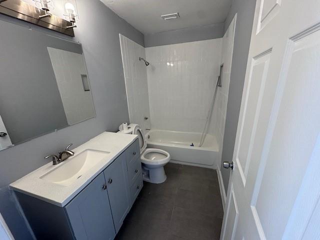 1109 West 28th Street, Unit 4 Riviera Beach, FL 33404 - Photo 2 of 12 a bathroom with a granite countertop sink a toilet and shower