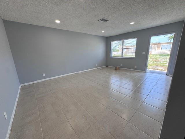 1109 West 28th Street, Unit 4 Riviera Beach, FL 33404 - Photo 6 of 12 a view of an empty room with a window