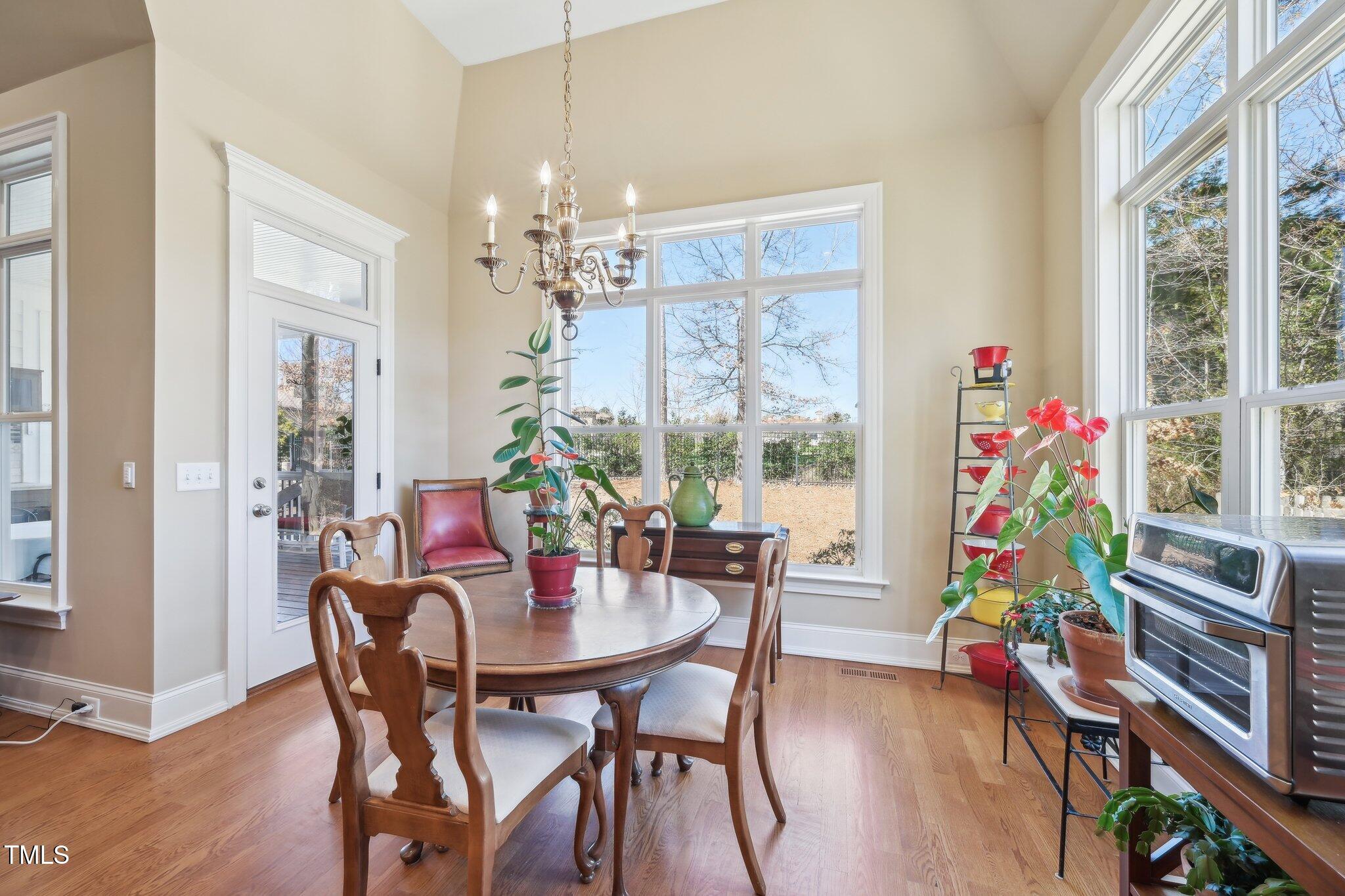 301 Kinsale Drive Durham, NC 27707 - Photo 13 of 68 a view of a dining room with furniture window and wooden floor