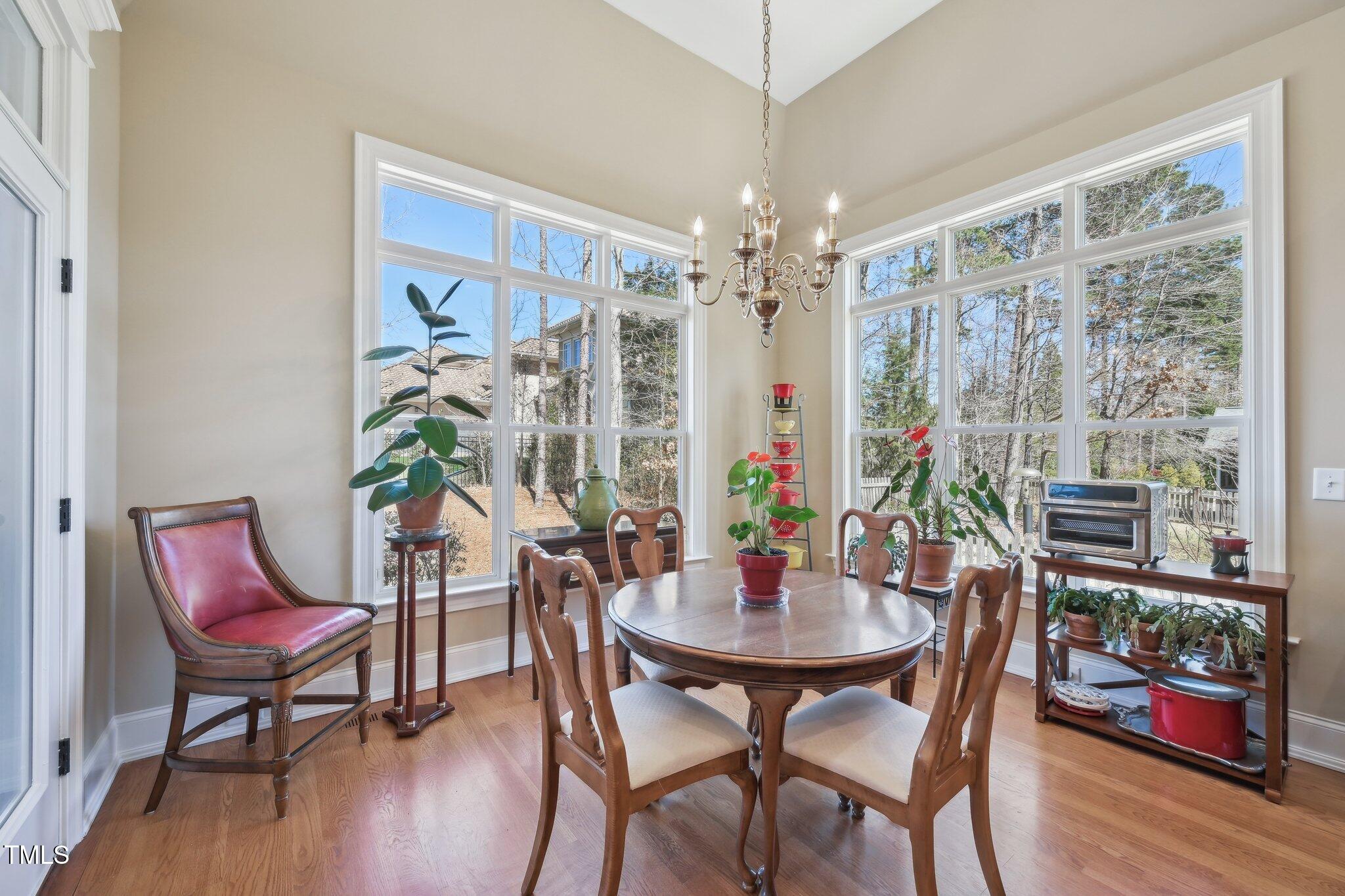 301 Kinsale Drive Durham, NC 27707 - Photo 14 of 68 a view of a dining room with furniture window and wooden floor