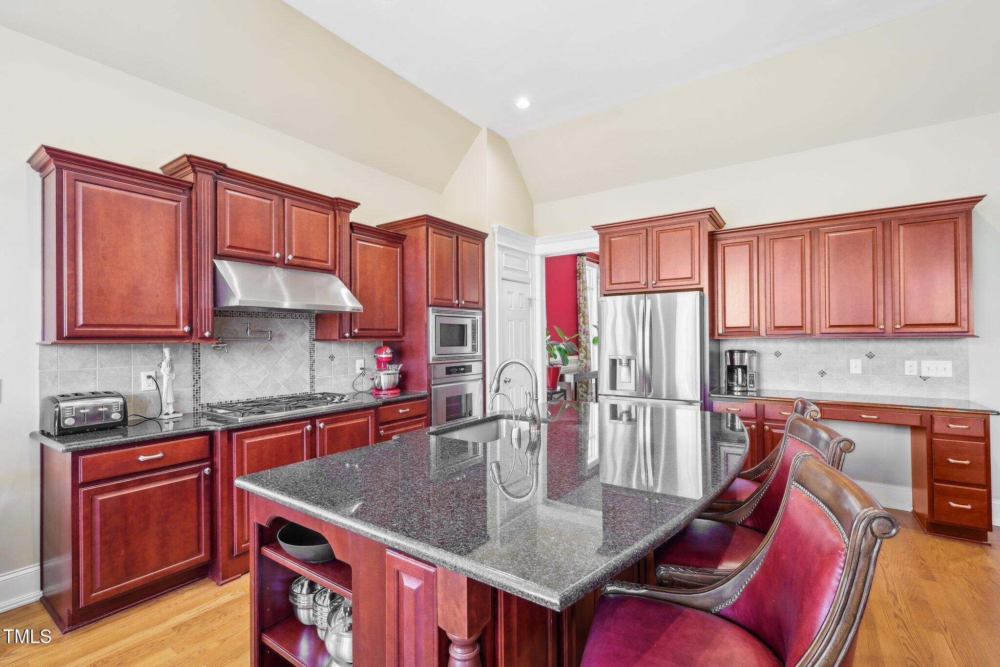 301 Kinsale Drive Durham, NC 27707 - Photo 17 of 68 a kitchen with stainless steel appliances granite countertop a sink dishwasher stove refrigerator and cabinets