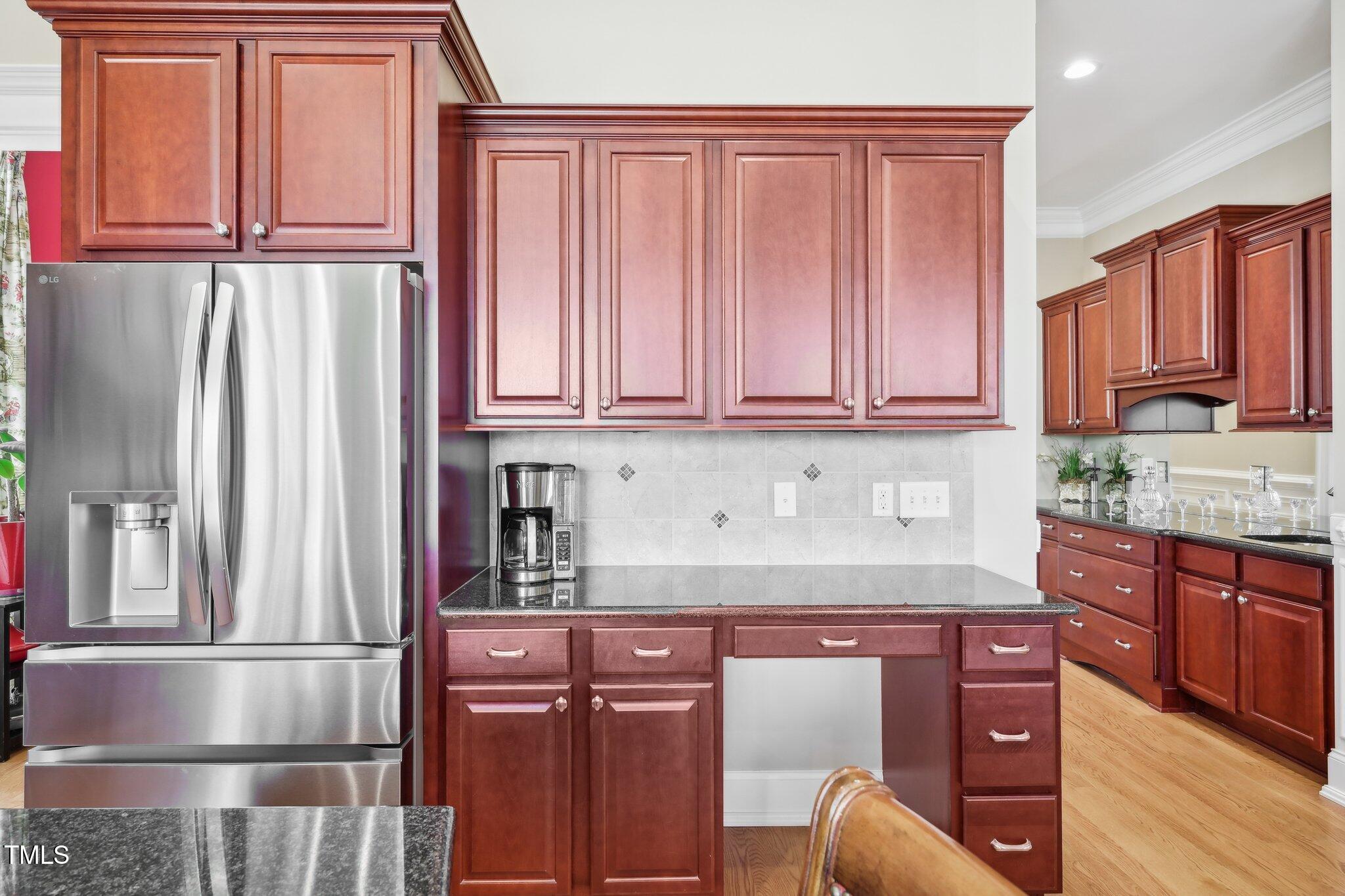 301 Kinsale Drive Durham, NC 27707 - Photo 23 of 68 a kitchen with stainless steel appliances granite countertop a refrigerator and cabinets