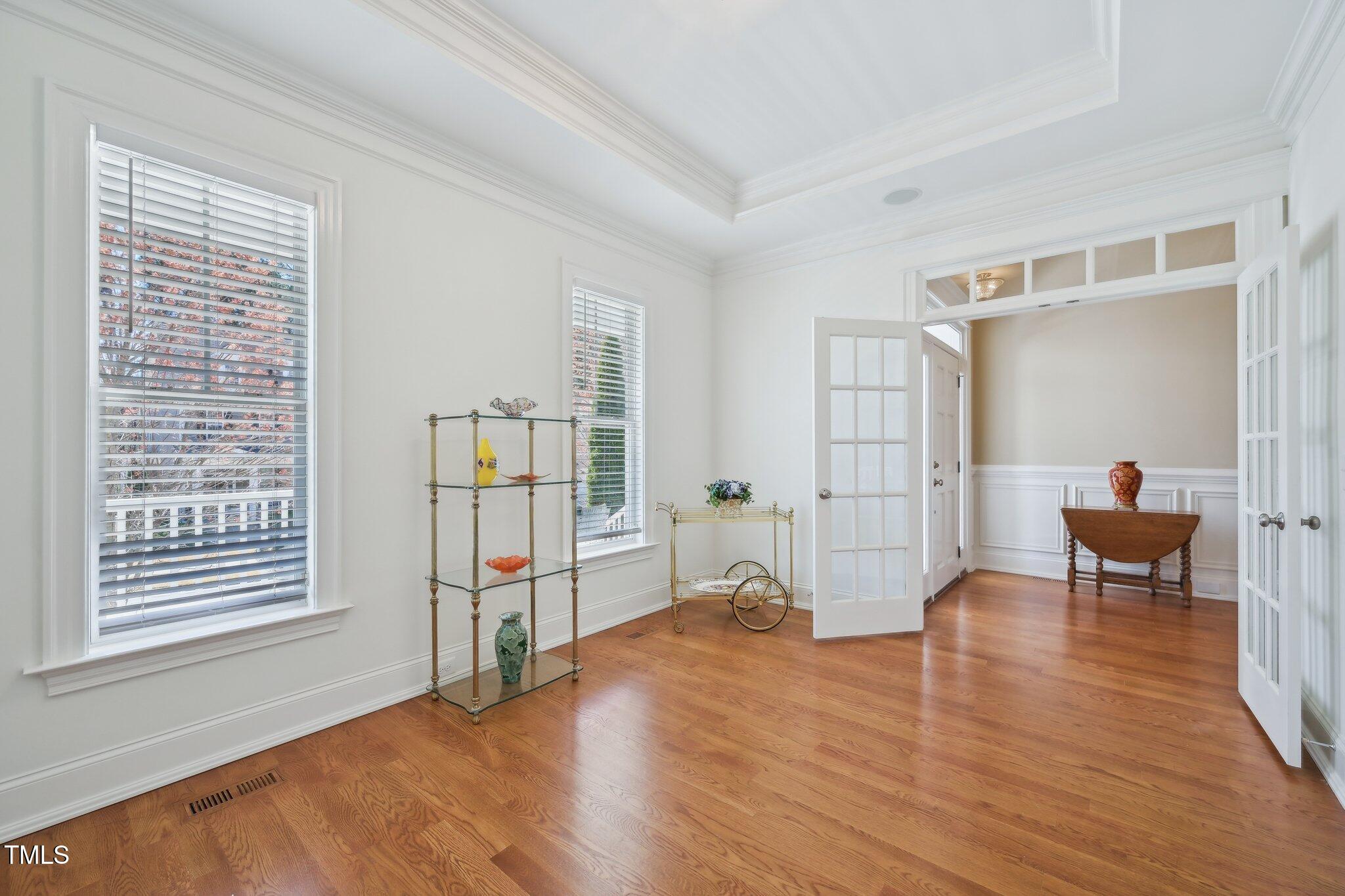 301 Kinsale Drive Durham, NC 27707 - Photo 25 of 68 a view of empty room with wooden floor and furniture