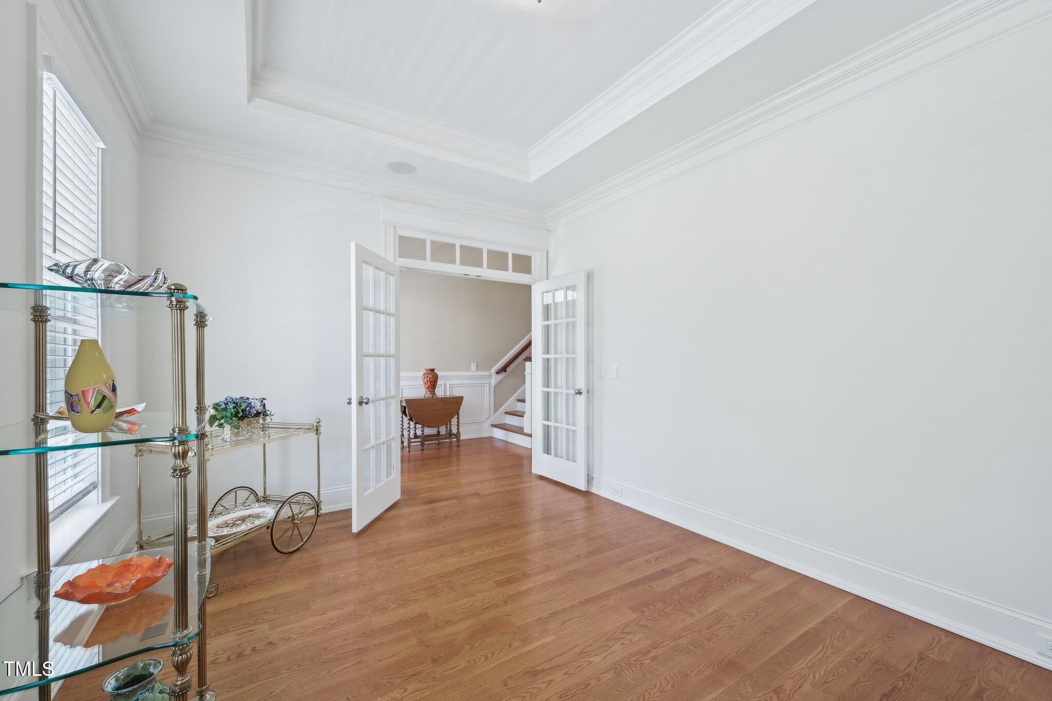 301 Kinsale Drive Durham, NC 27707 - Photo 26 of 68 a view of an empty room with wooden floor and a window