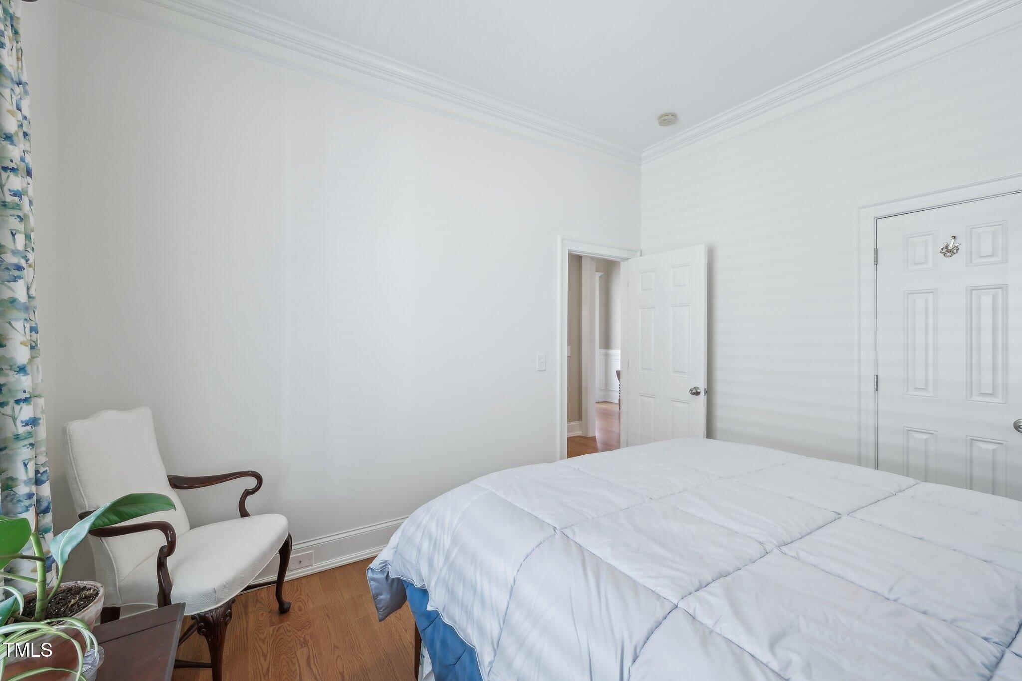 301 Kinsale Drive Durham, NC 27707 - Photo 28 of 68 a bedroom with a bed and a chair