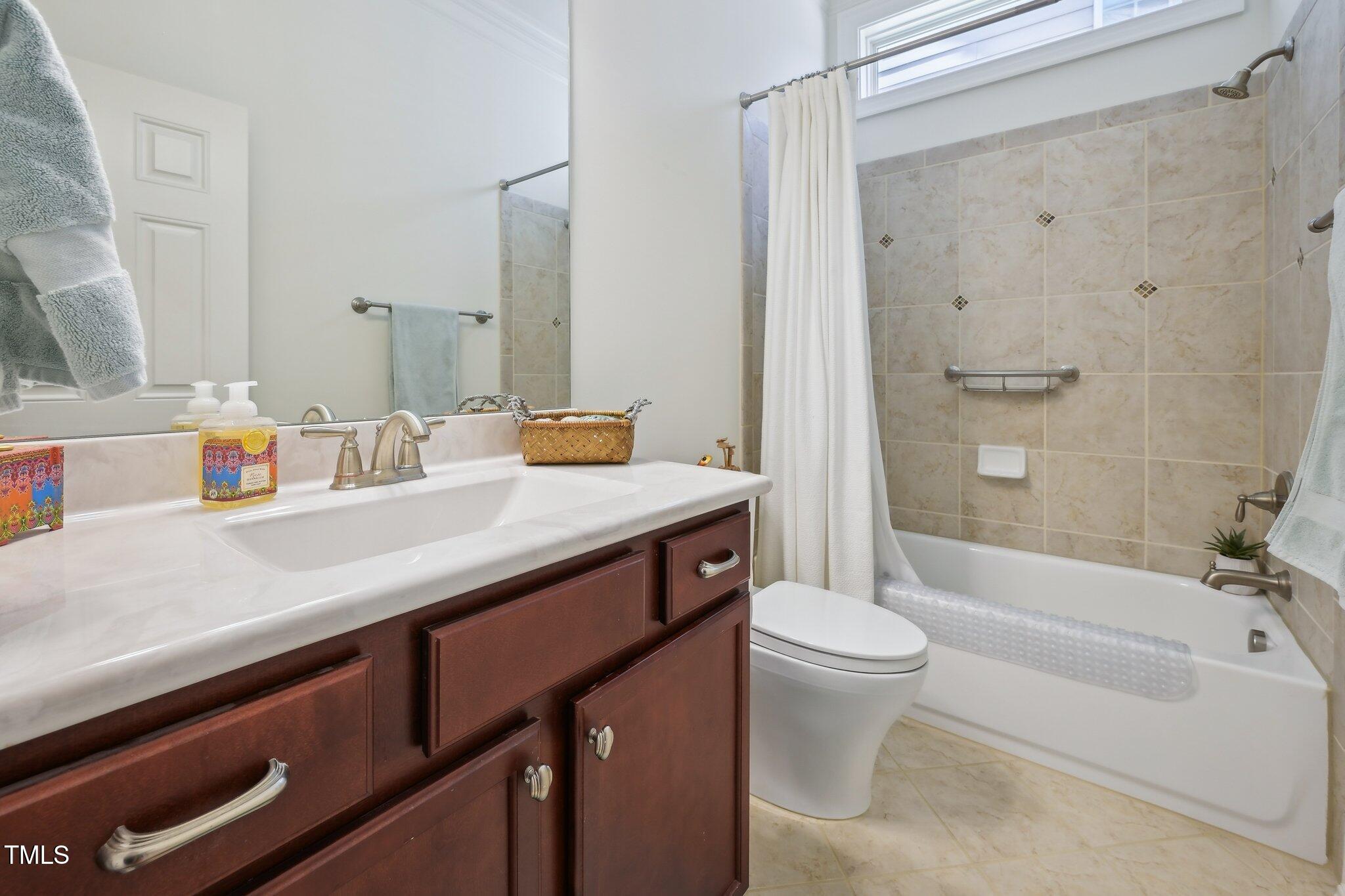 301 Kinsale Drive Durham, NC 27707 - Photo 29 of 68 a bathroom with a sink a toilet and shower